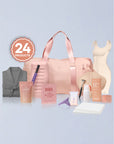 Collection of beauty products including a pink bag, bottles, and a robe on a light blue background.