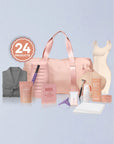 Collection of beauty products including a pink bag, bottles, and a robe on a light blue background.