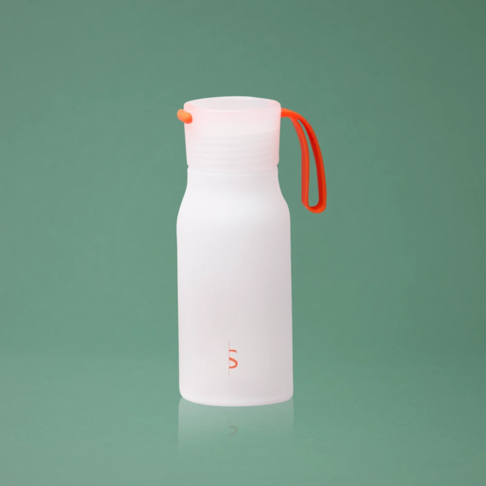BeShapy Luxury BBL Recovery Kit White water bottle with an orange handle on a green background