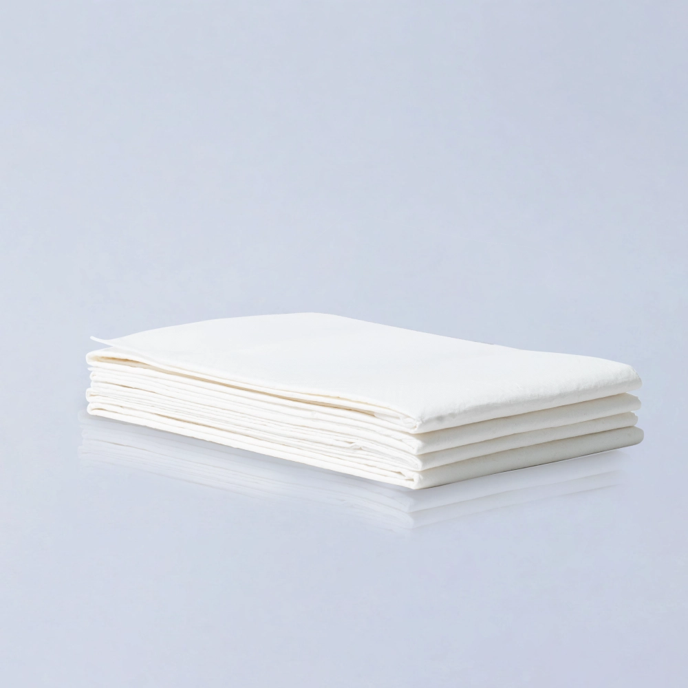 BeShapy Luxury BBL Recovery Kit healing essentials Stack of white bed pads on a light gray background
