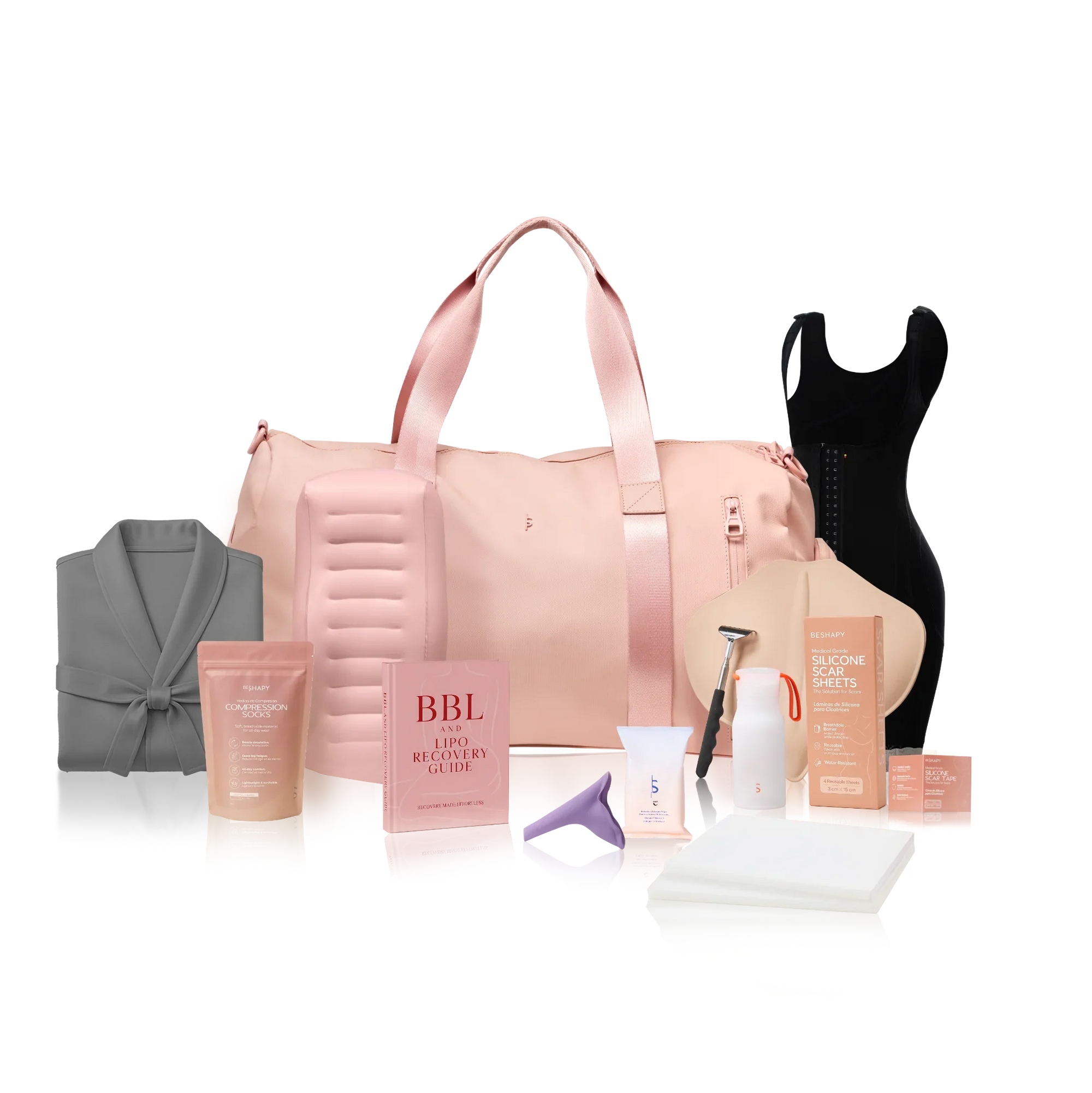 Organized hospital bag laid open with plastic surgery recovery essentials including compression garment, charger, slip-on shoes, and toiletries