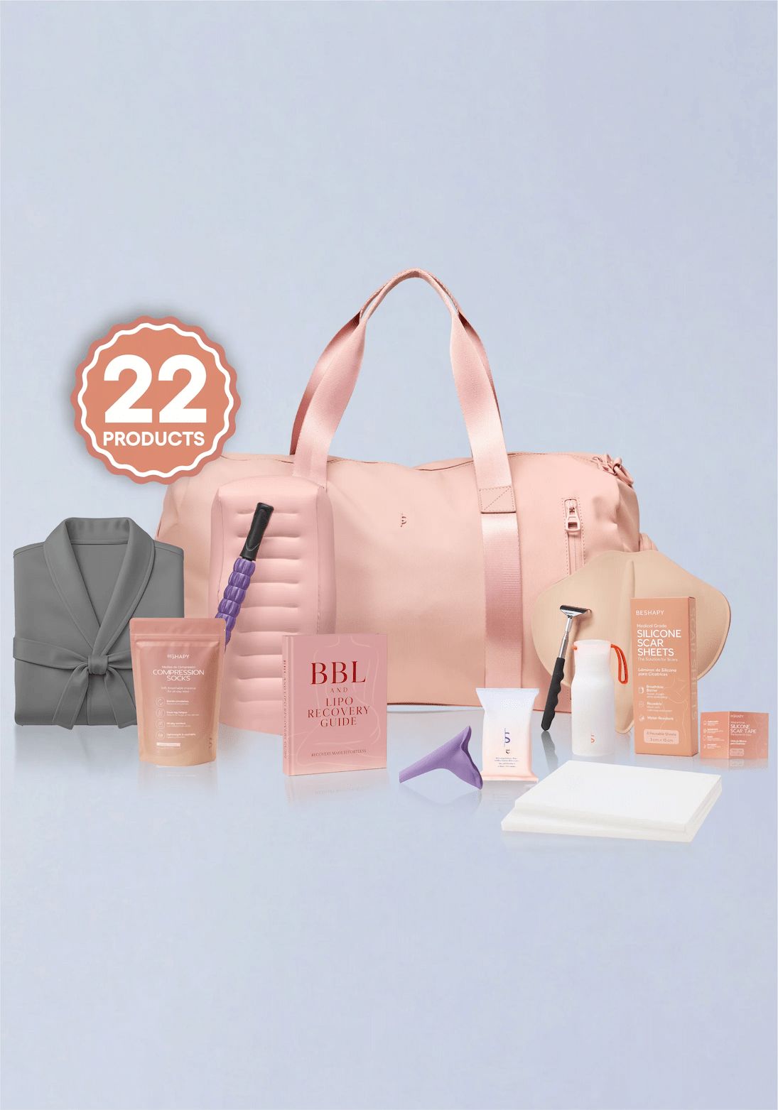 Collection of beauty products including a pink duffel bag, skincare items, and a robe on a light blue background.
