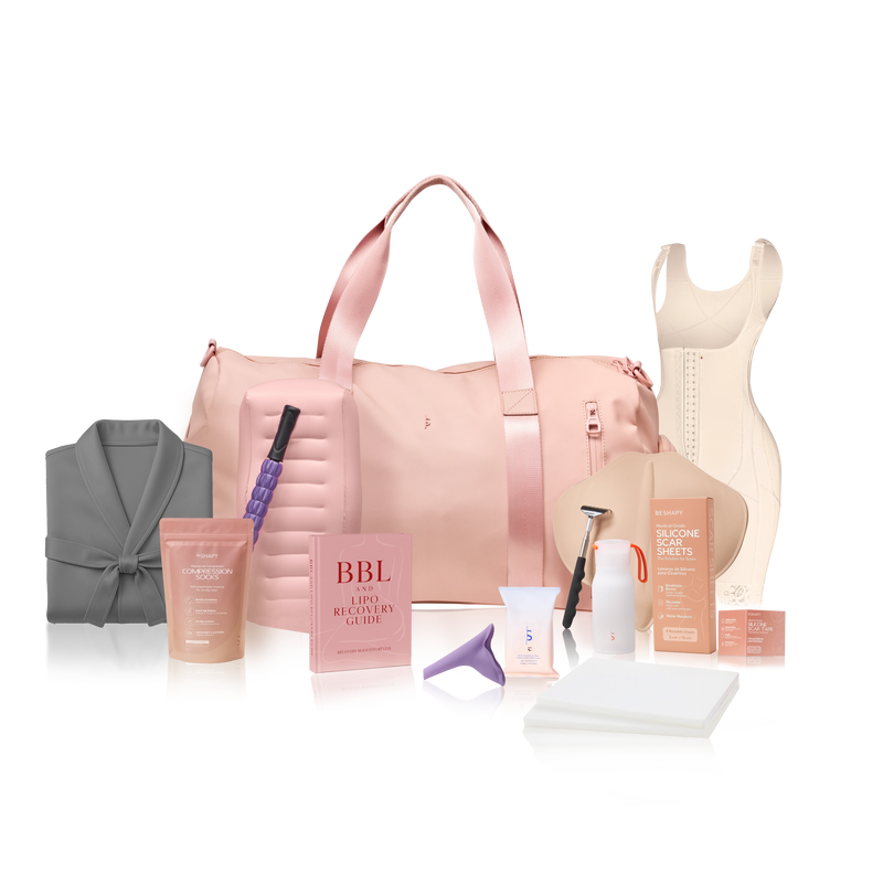 Collection of beauty and self-care products including a pink duffel bag, robe, and various items on a white background.