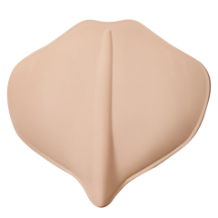 Beige silicone breast pad on a white background