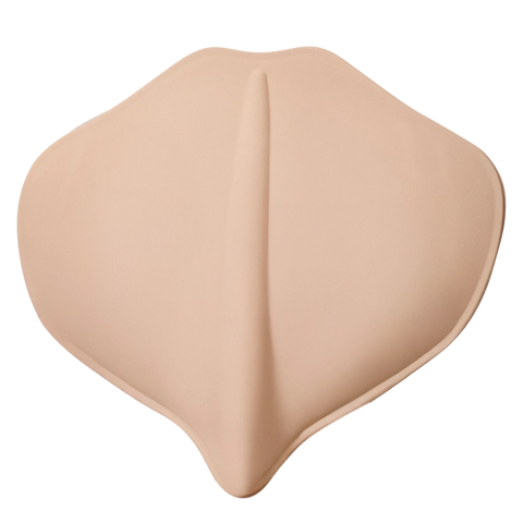Beige silicone breast pad on a white background